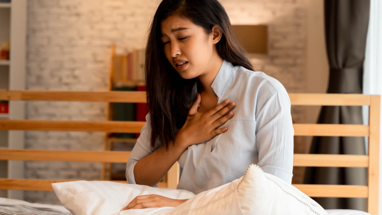 a woman sitting on a bed