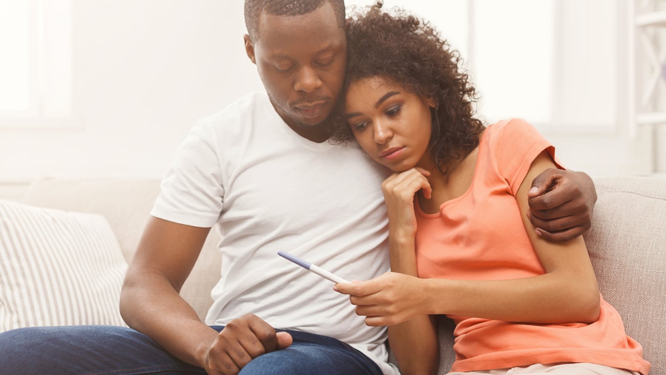 a man and a woman sitting on a couch