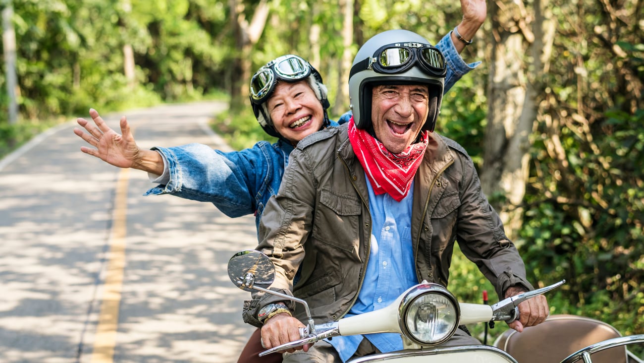 older male and female on scooter