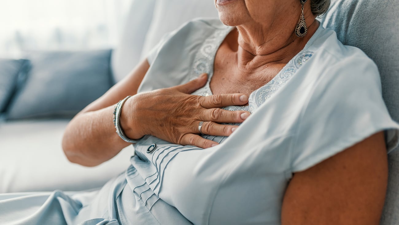 Woman holding chest