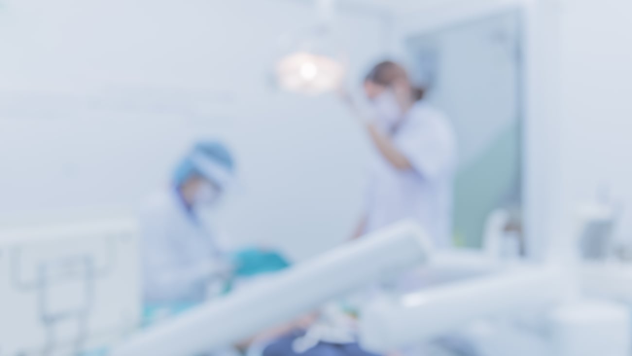 Hospital employees helping a patient