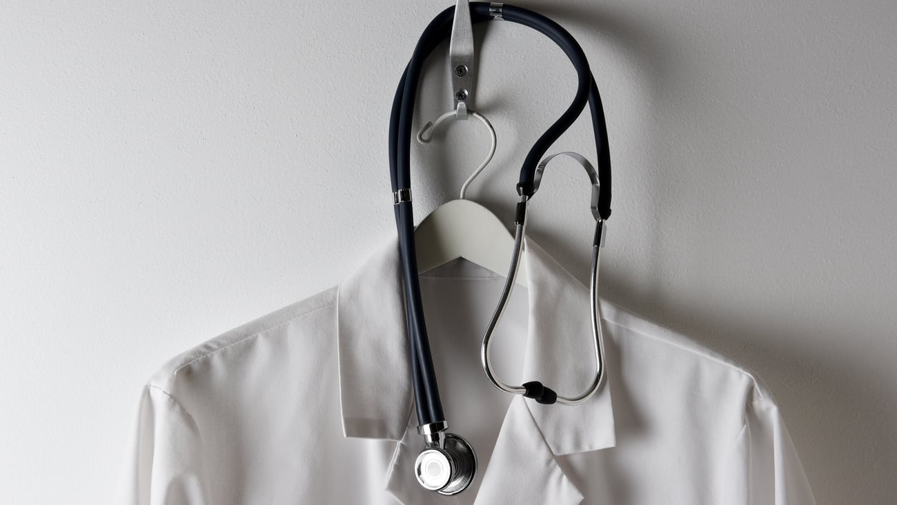 Lab coat on a hanger with stethoscope