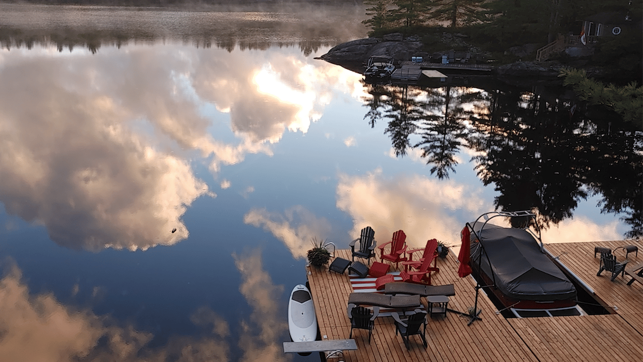 clouds reflected in lake at dock