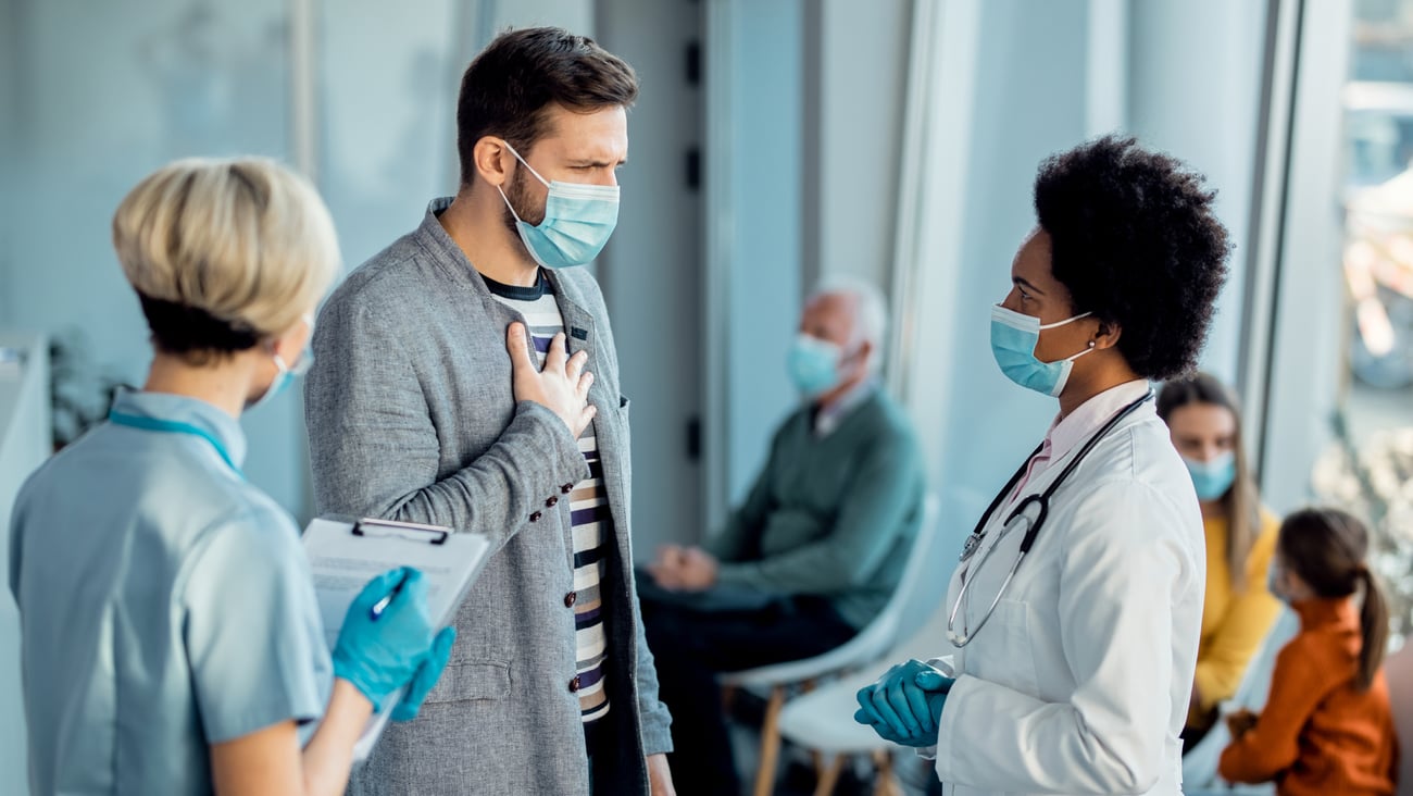 Young man discussing heart health issue with doctor