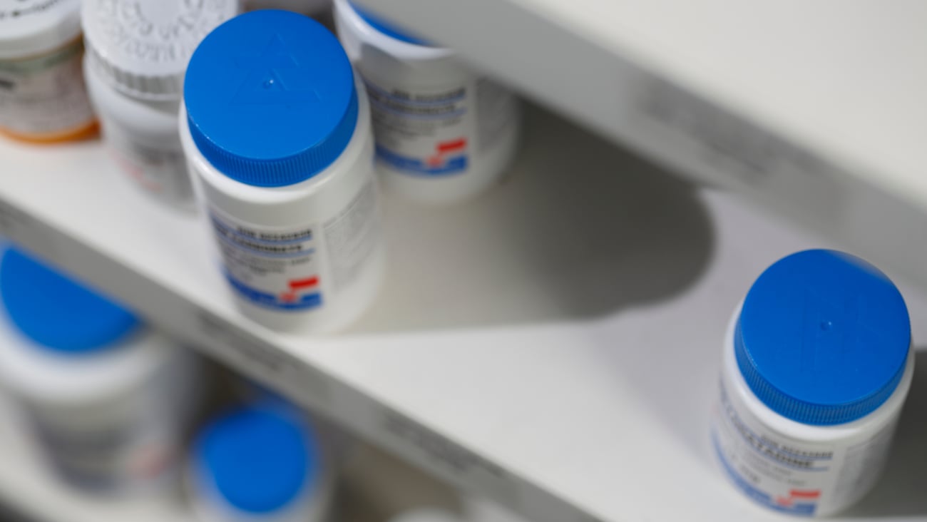 Bottles of medicine on a pharmacy shelf