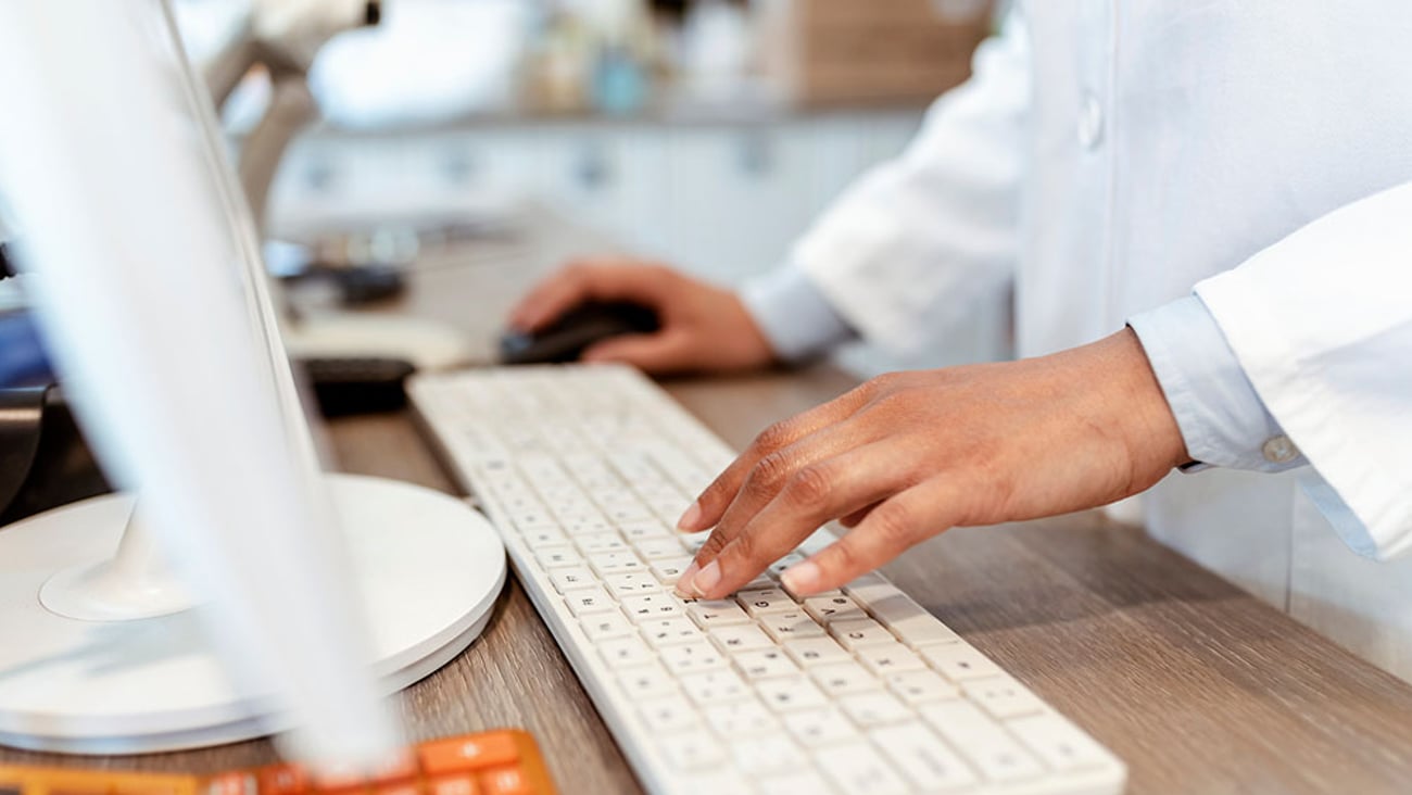 closeup of a keyboard as a pharmacist checked a computer