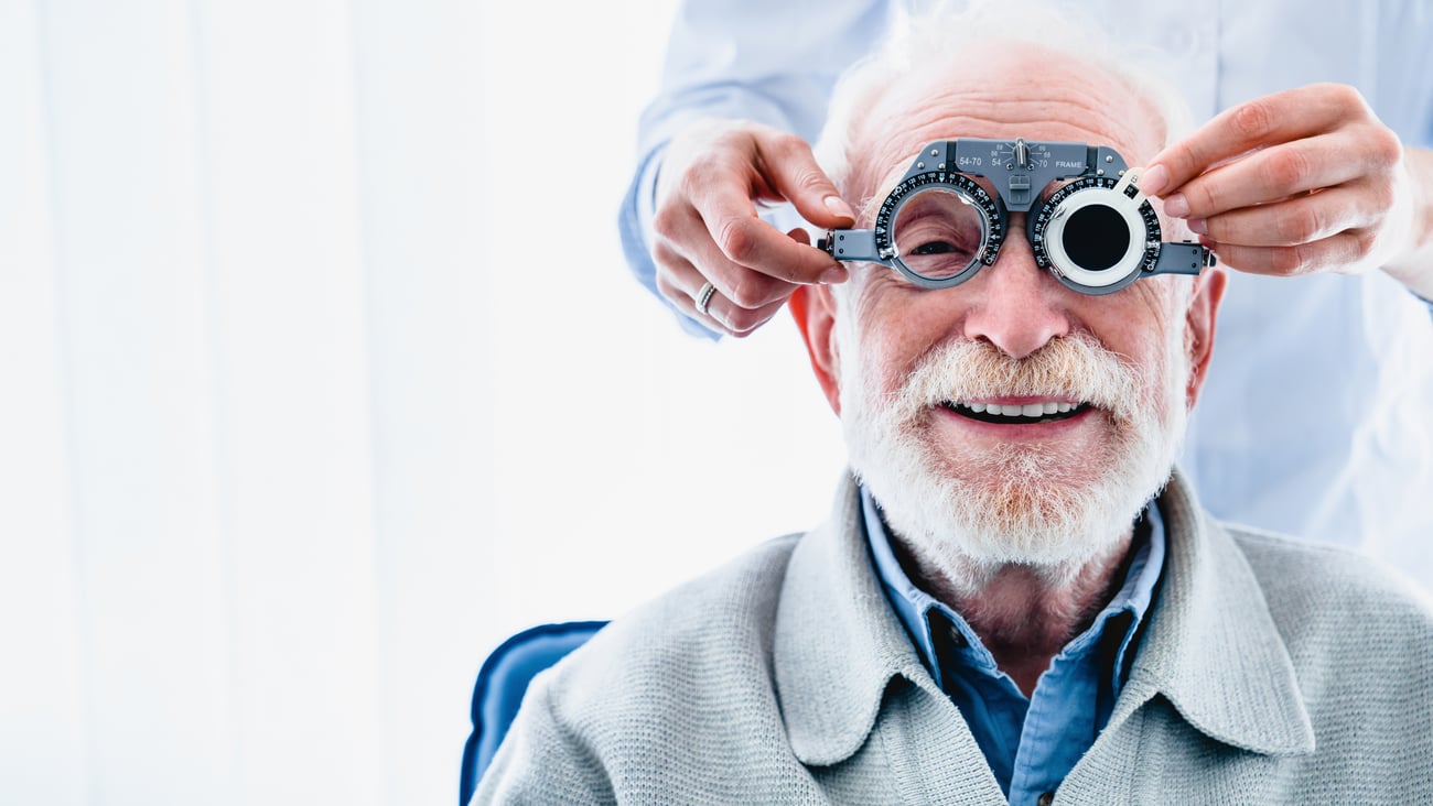 Older man being given an eye exam