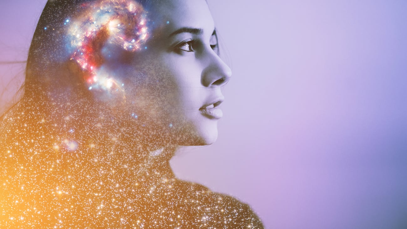 Young woman with clouds in her head, visualizing her thoughts