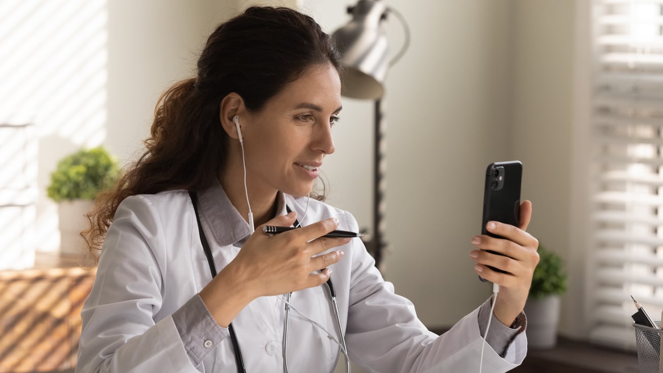 A doctor talking to a patient over the phone