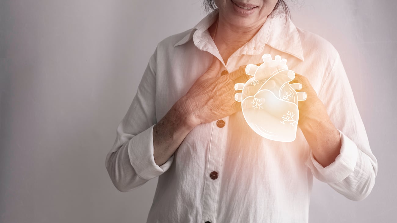 Older woman holding her heart