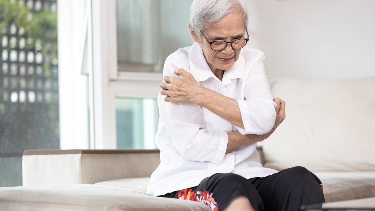 Older woman suffering from an itch