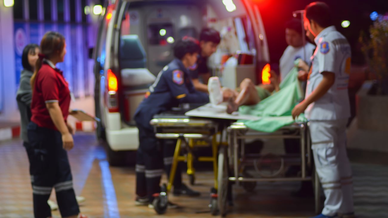 Patient being loaded into an ambulance