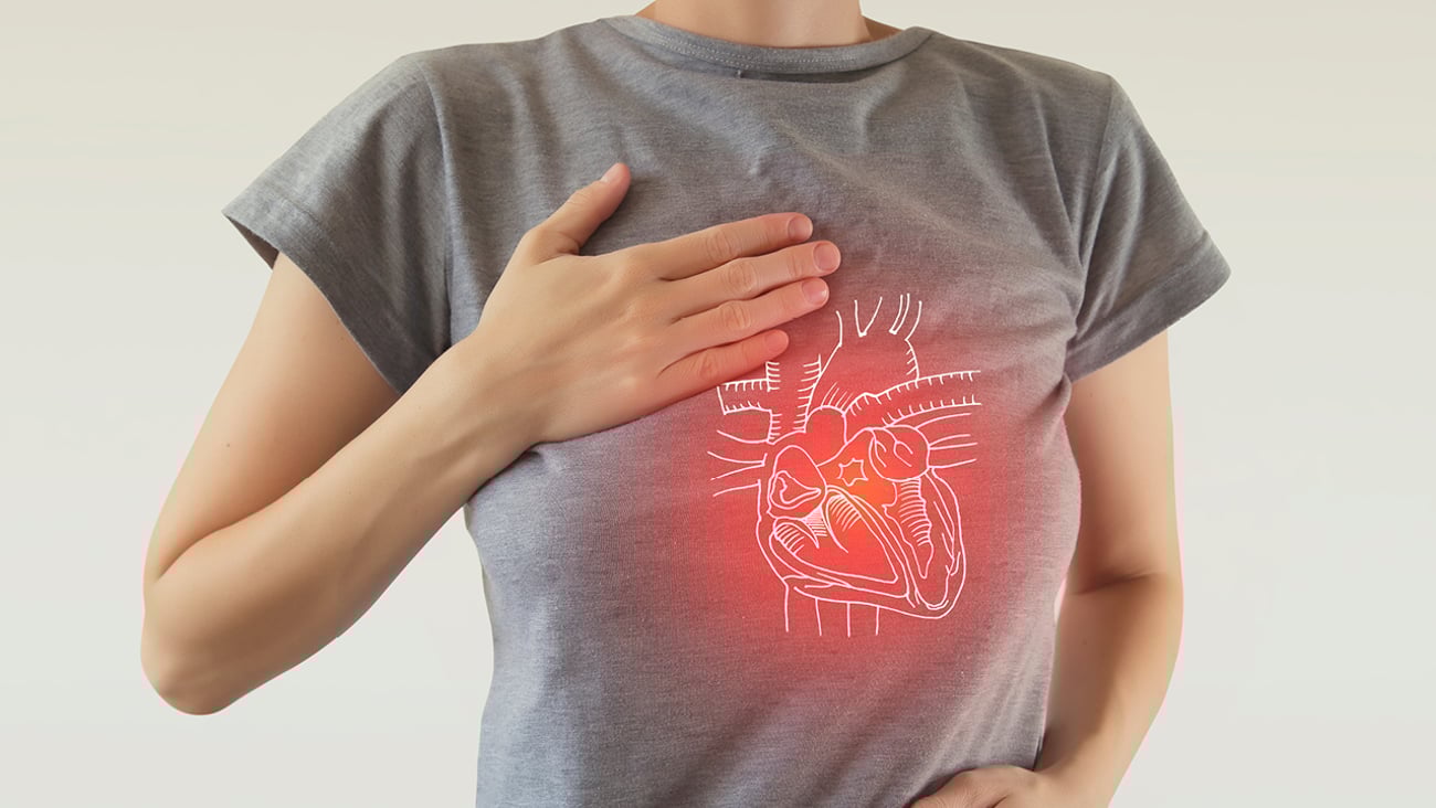Young woman with a cartoon of her heart shown over her shirt
