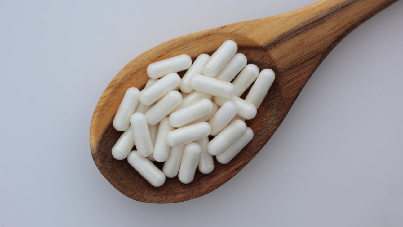 Pile of Inositol supplements in a spoon