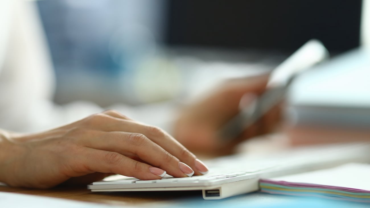 hands on keyboard, white coat, medical setting