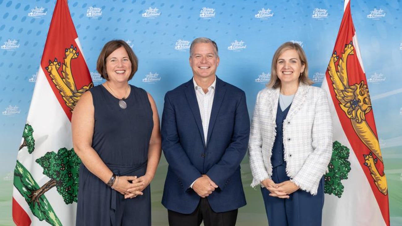 Medical Society of PEI president Dr. Krista Cassell, P.E.I. Health Minister Mark McLane and Health PEI CEO Melanie Fraser pose for a photo after the signing of the Physician Services Agreement on Aug. 8, 2024. (Government of Prince Edward Island)