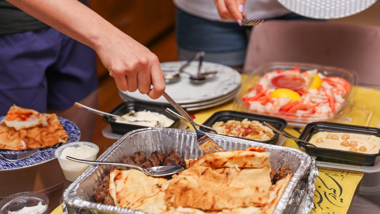 Plates of food at a potluck party.
