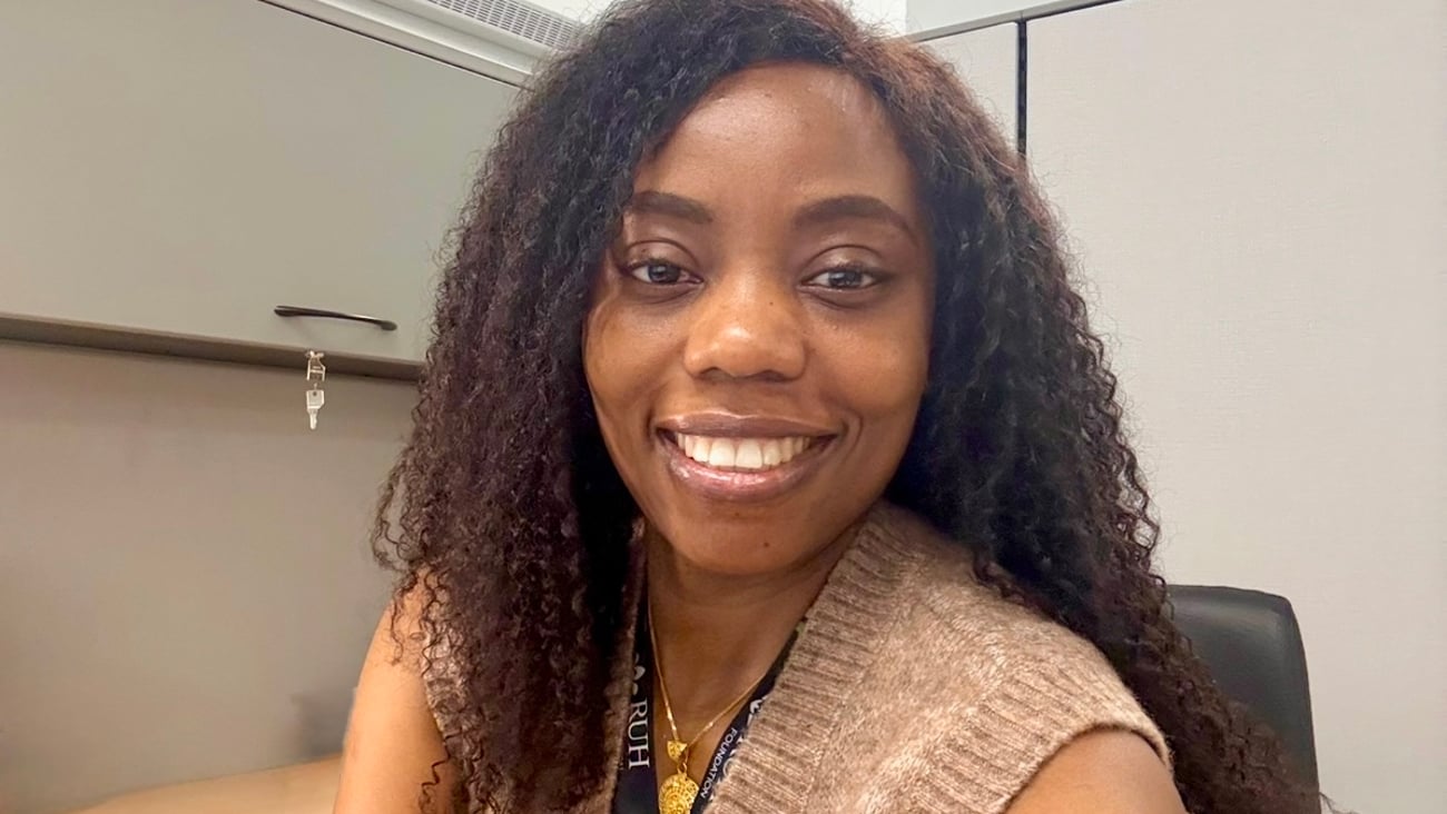 Henrietta Ezegbe smiling in an office for a photo