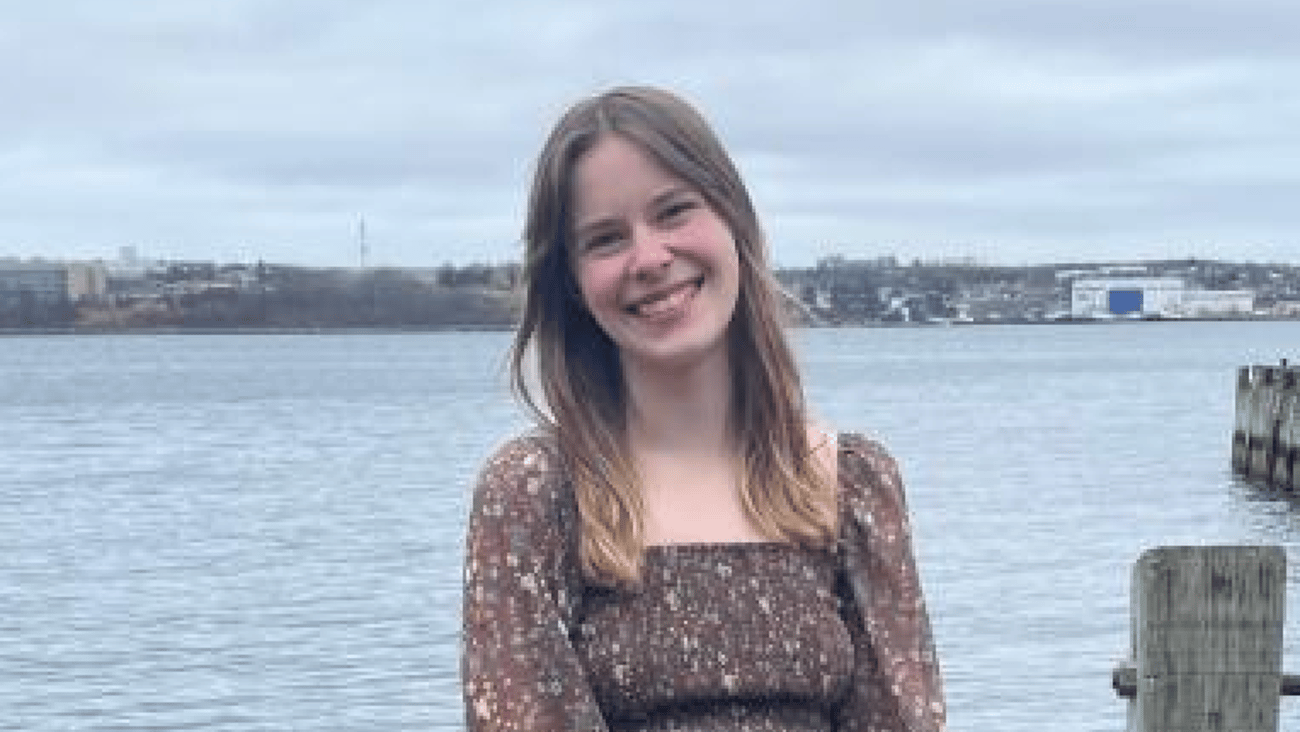 Isabella Baan standing by the waterfront