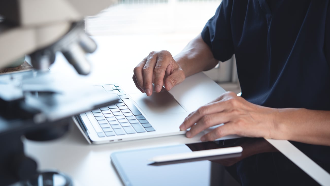 Doctor working at a desk at a laptop
