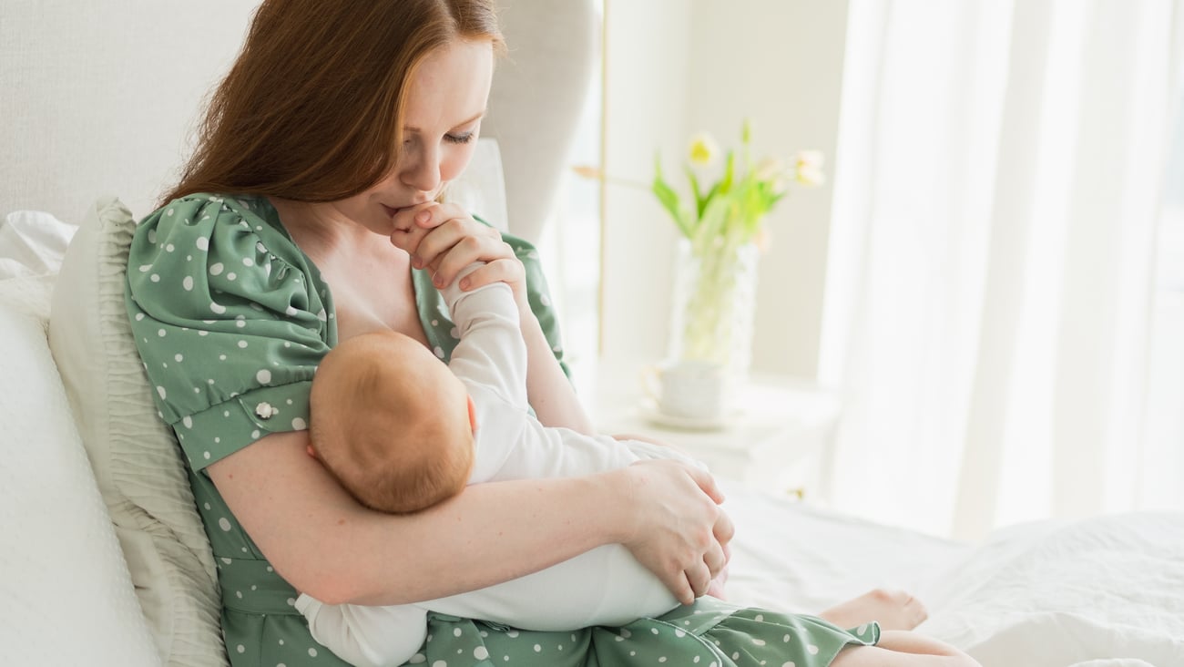 woman breastfeeding her baby