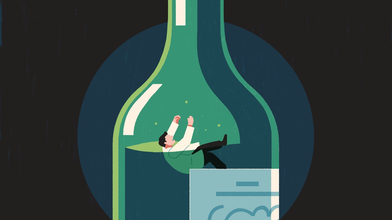 Pharmacist drowning in an oversized bottle of alcohol