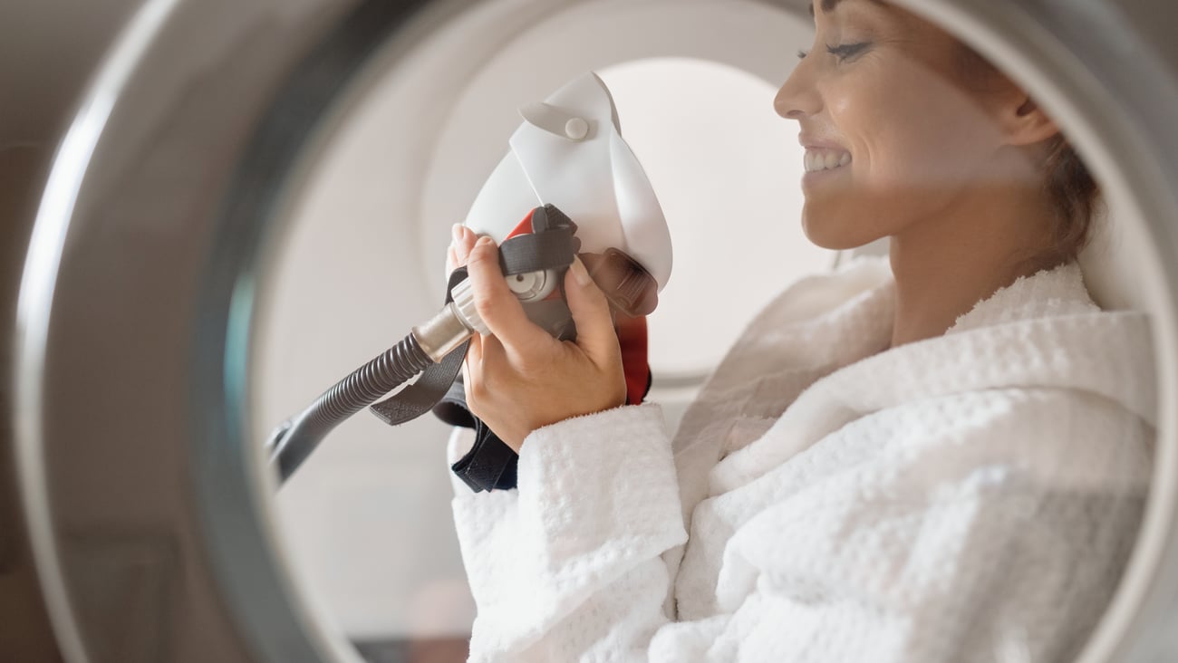 A woman receiving hyperbaric oxygen therapy