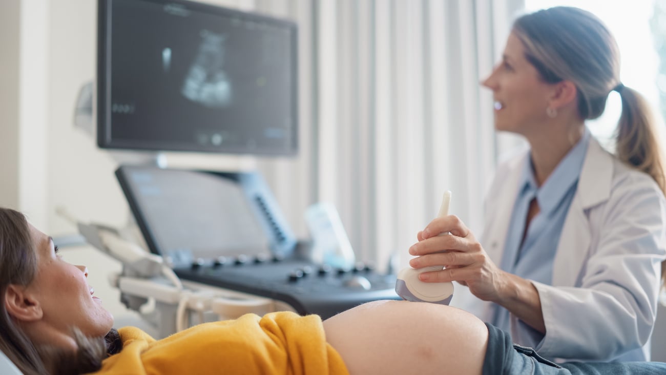 Young pregnant woman getting an ultrasound