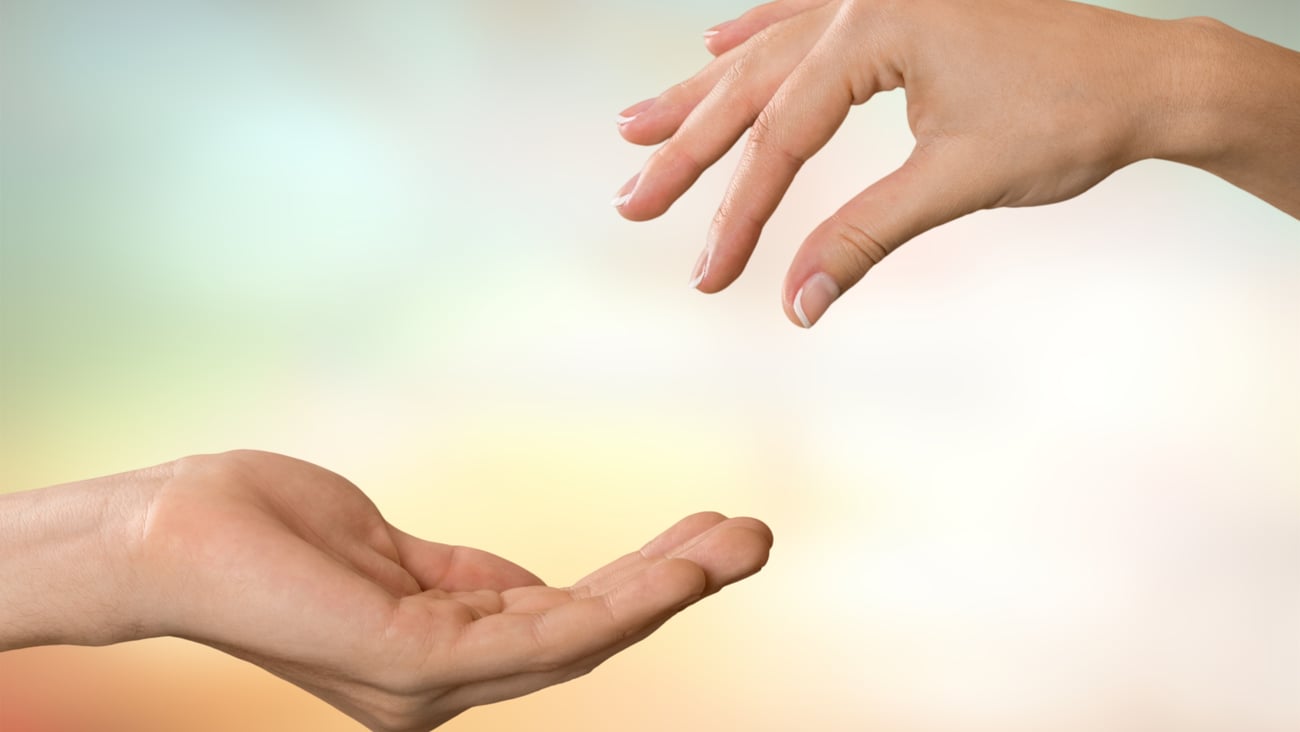 One empty hand giving to another hand