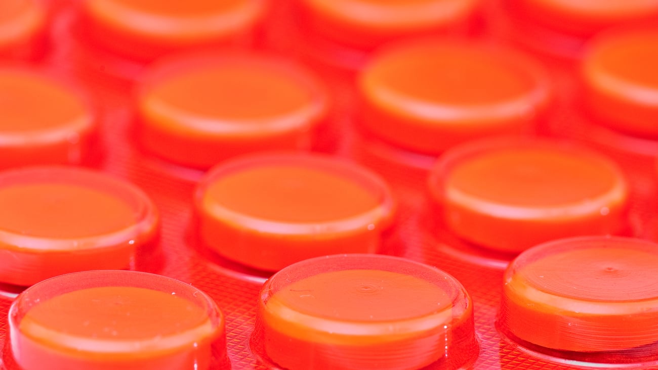 Pills in a red blister pack