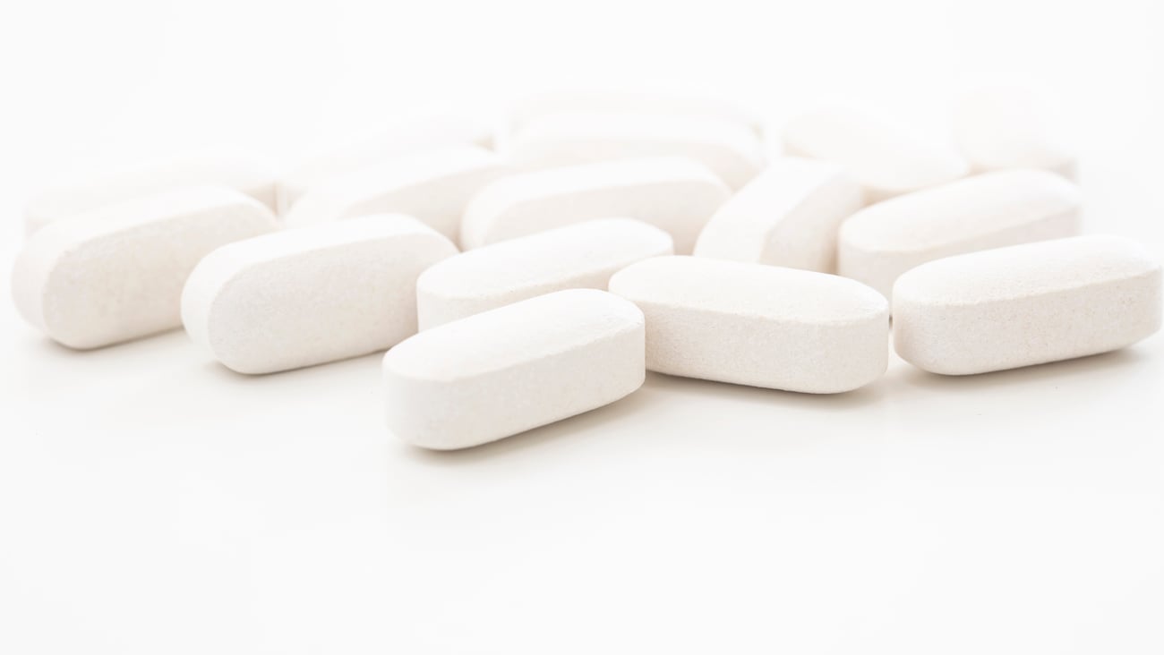 Close up of White Pills Isolated on White Background are ready to use for treatment