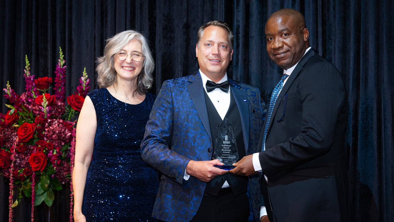 A physician receiving an award