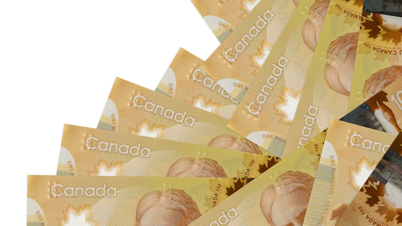 A pile of Canadian $100 bills