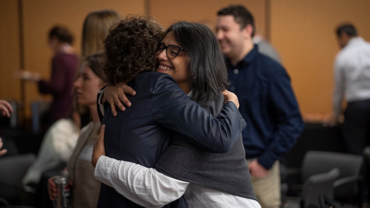 People embracing at a reunion 