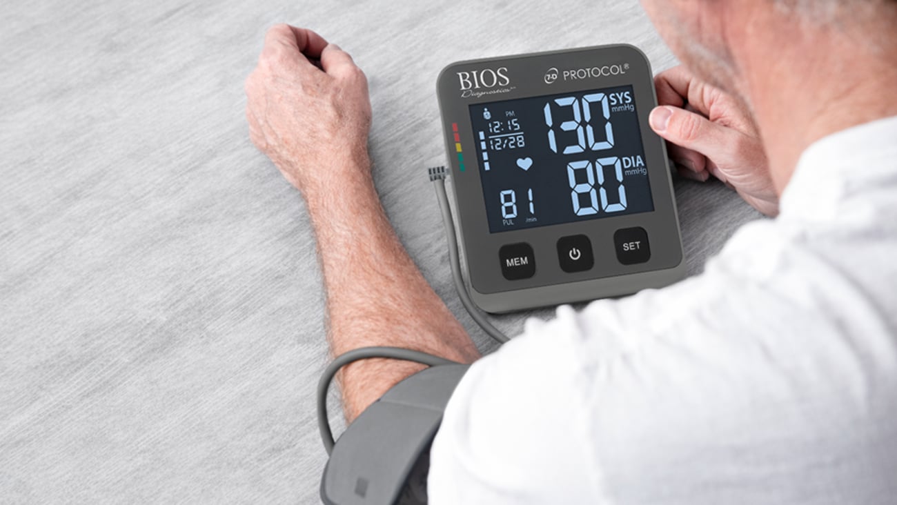 a patient checks their blood pressure using a BIOS Medical device