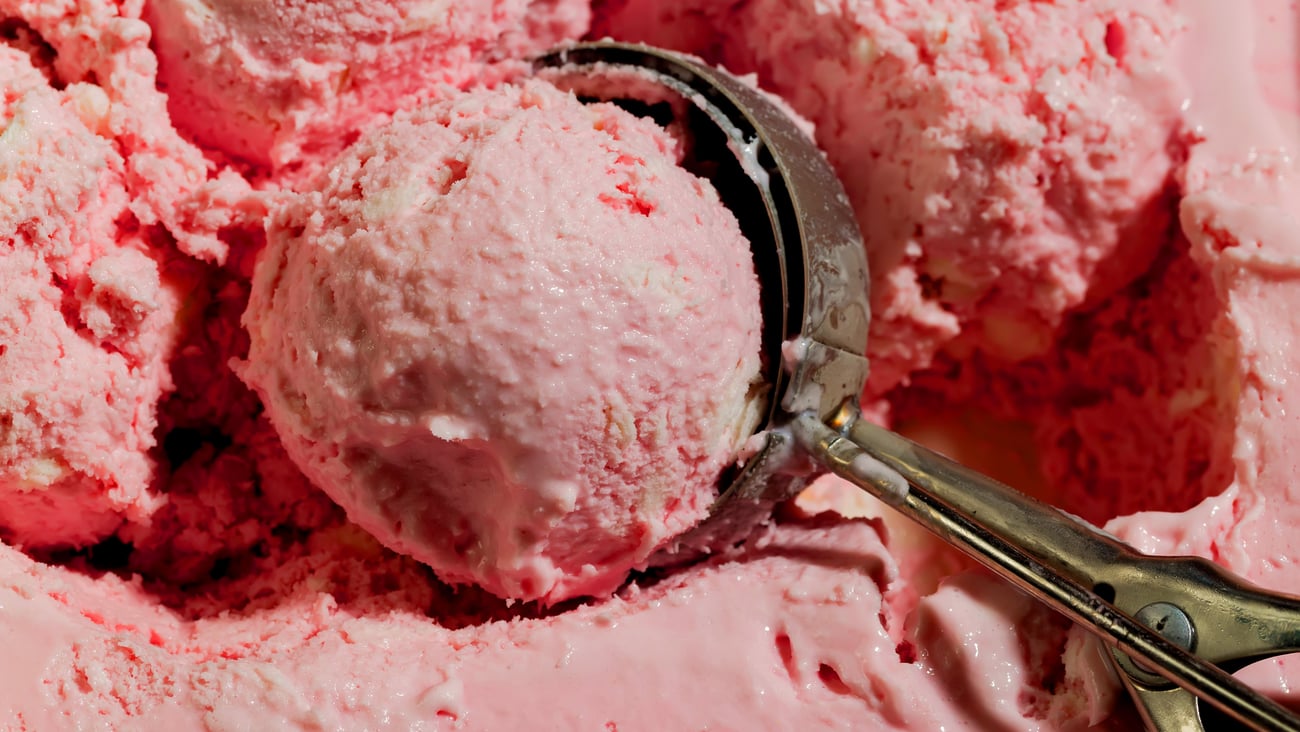 Old timey ice cream scooper with strawberry ice cream