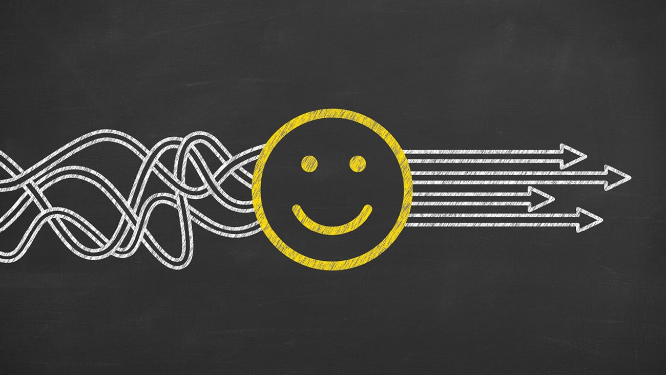 A cartoon of a happy face unscrambling a knot of paths