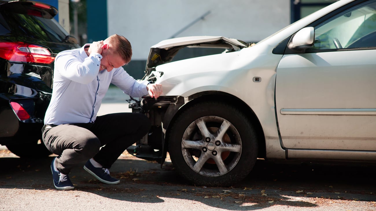 A young man seeks compensation after injury from a car accident causing whiplash pain.
