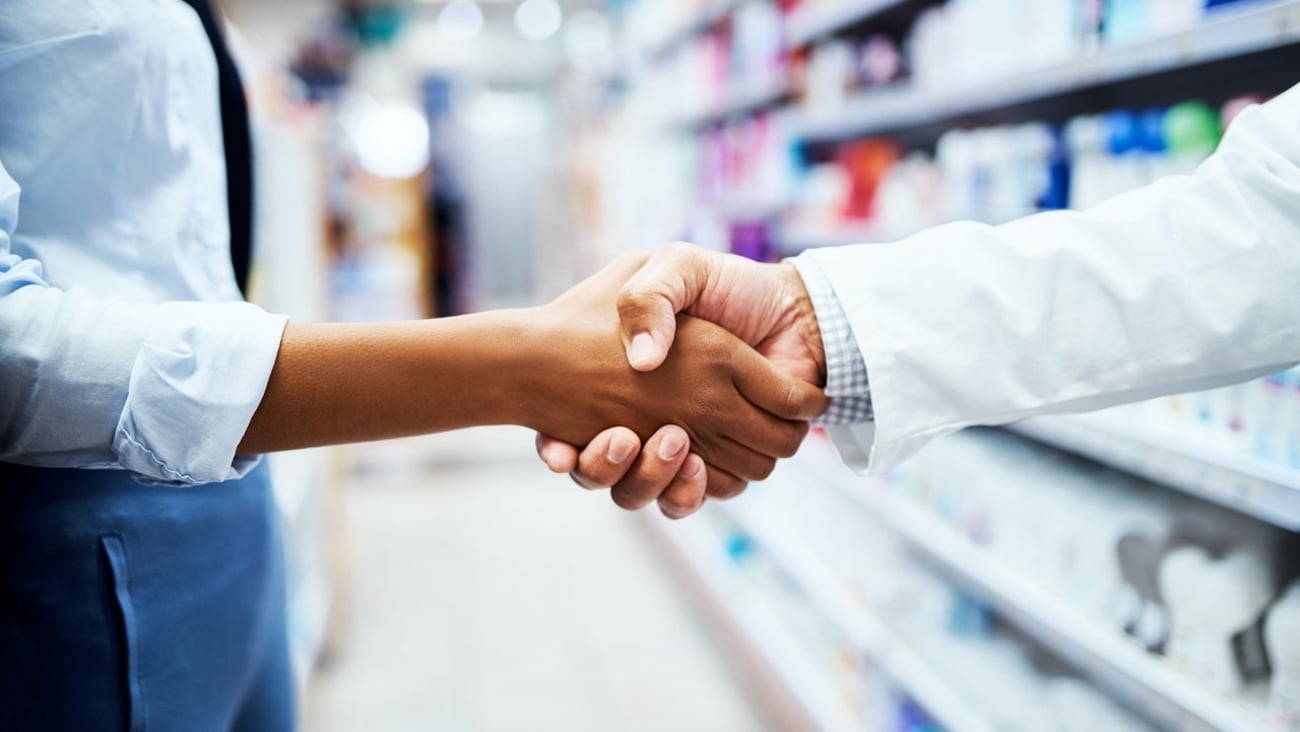 Pharmacists shaking hands.