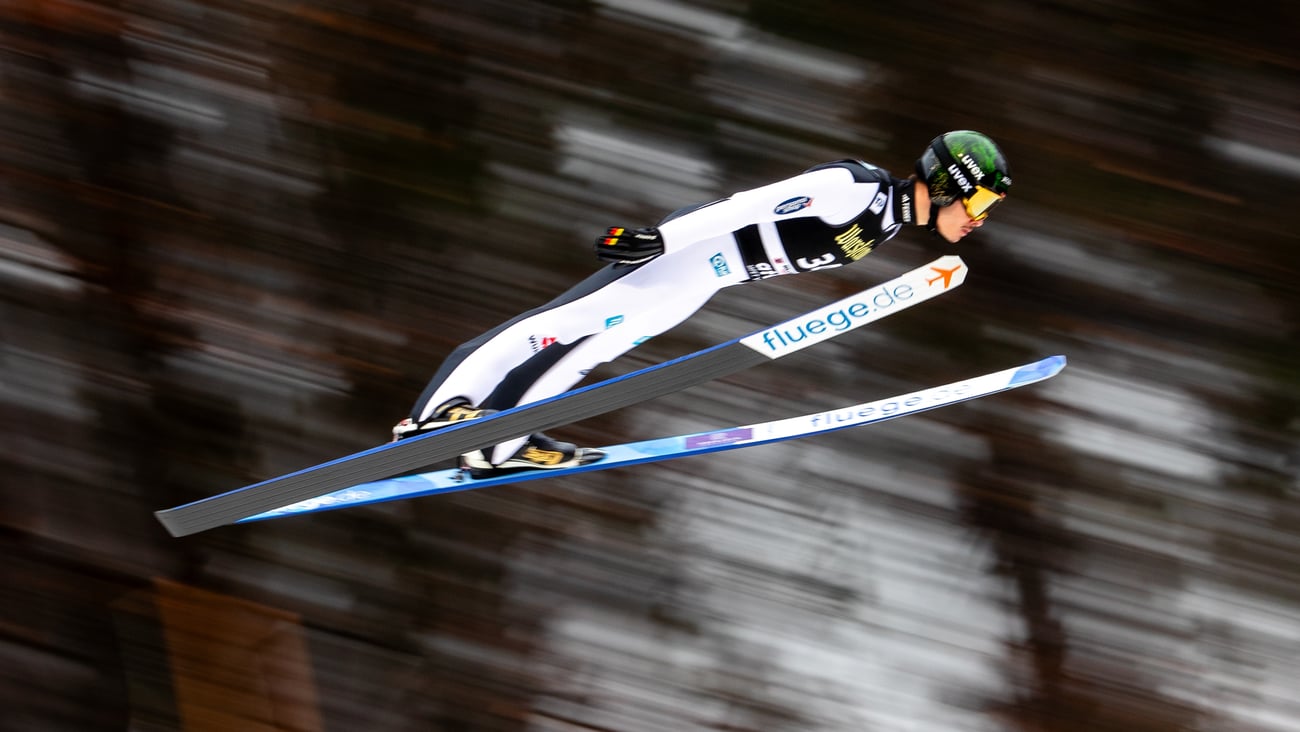 Athlete performing ski jumping