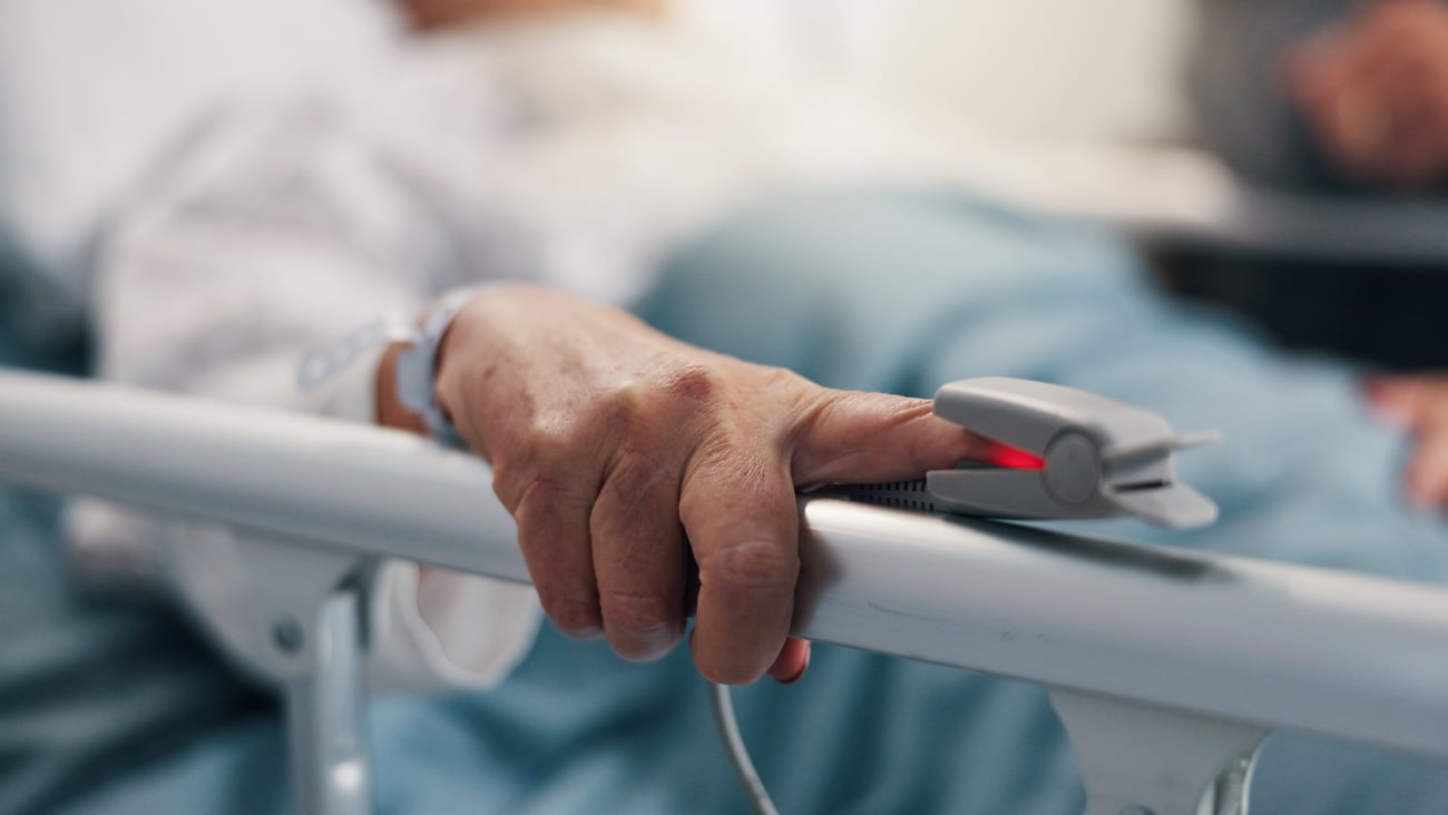 Older man in a hospital bed