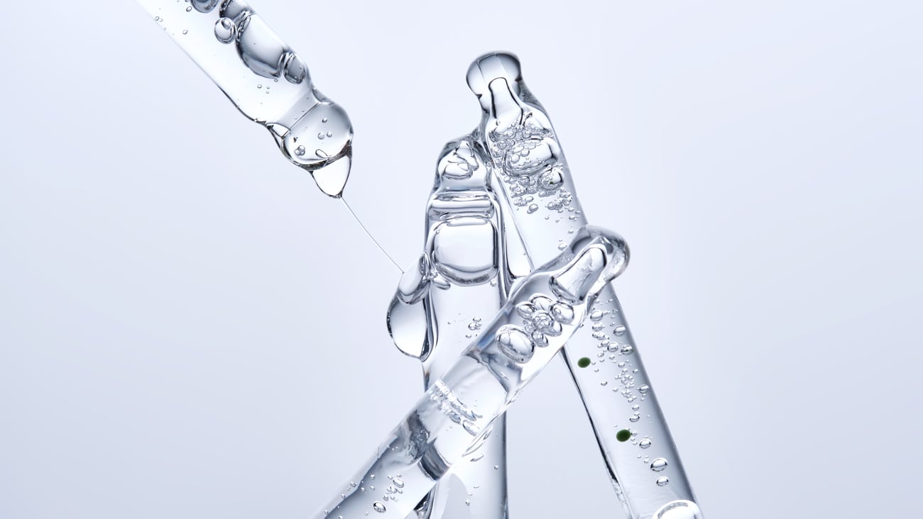 Several droppers with a gooey serum in them