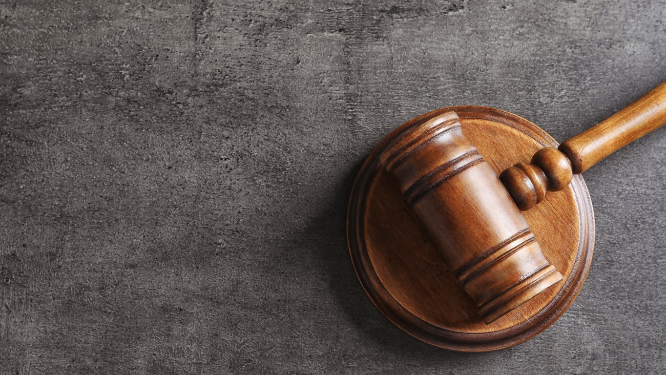Judge's gavel on grey background, top view