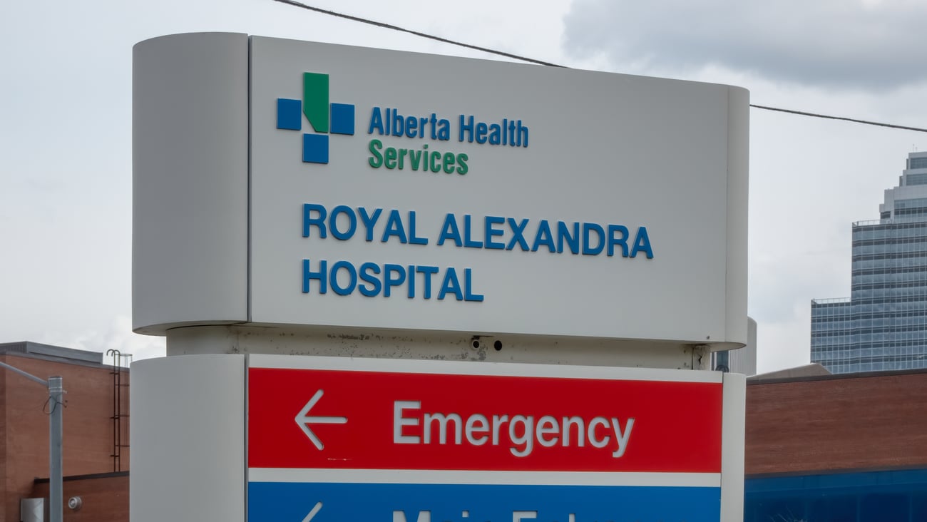 A sign directs to the Royal Alexandra Hospital in Edmonton and its emergency and main entrances.