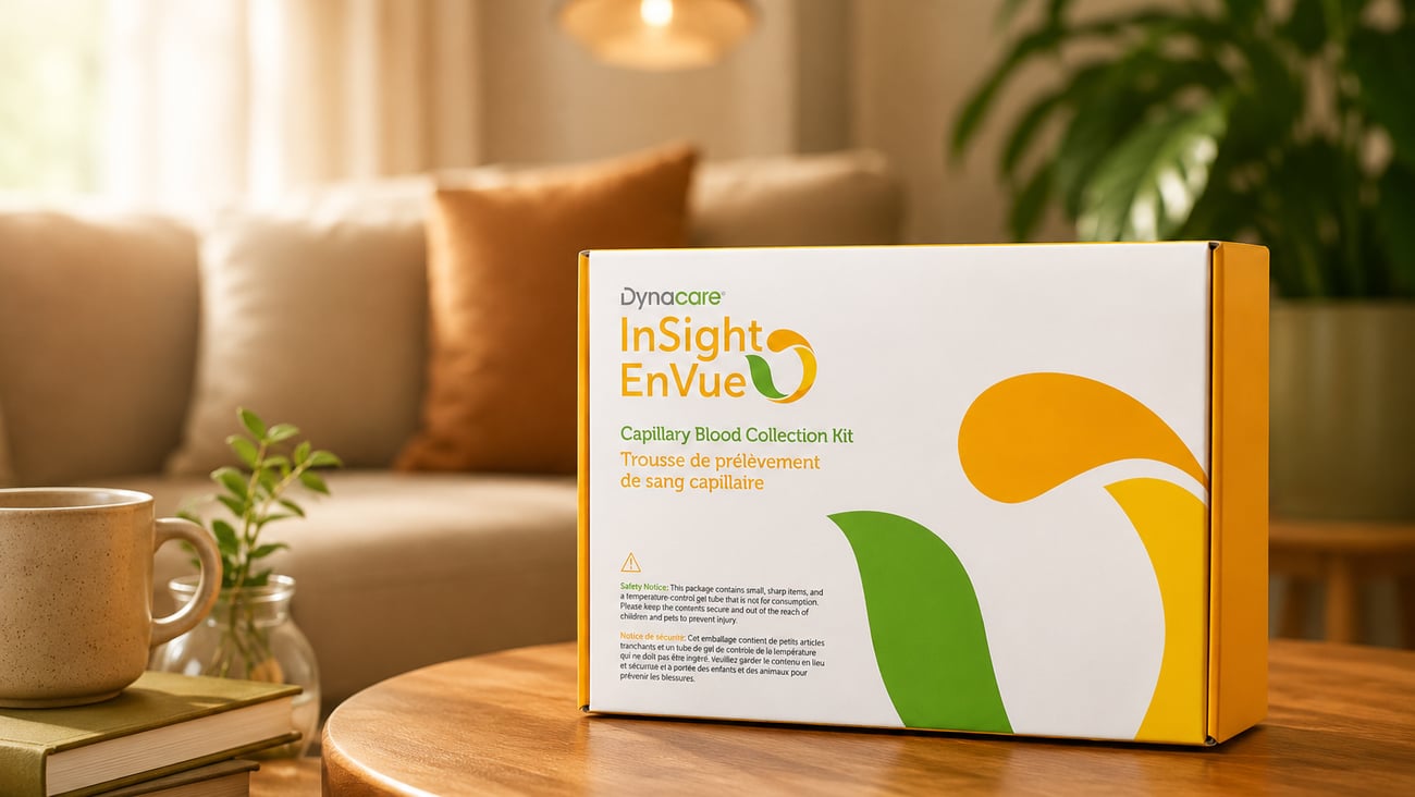 Dynacare at-home blood tests sit in a box on a coffee table in a warmly-lit home