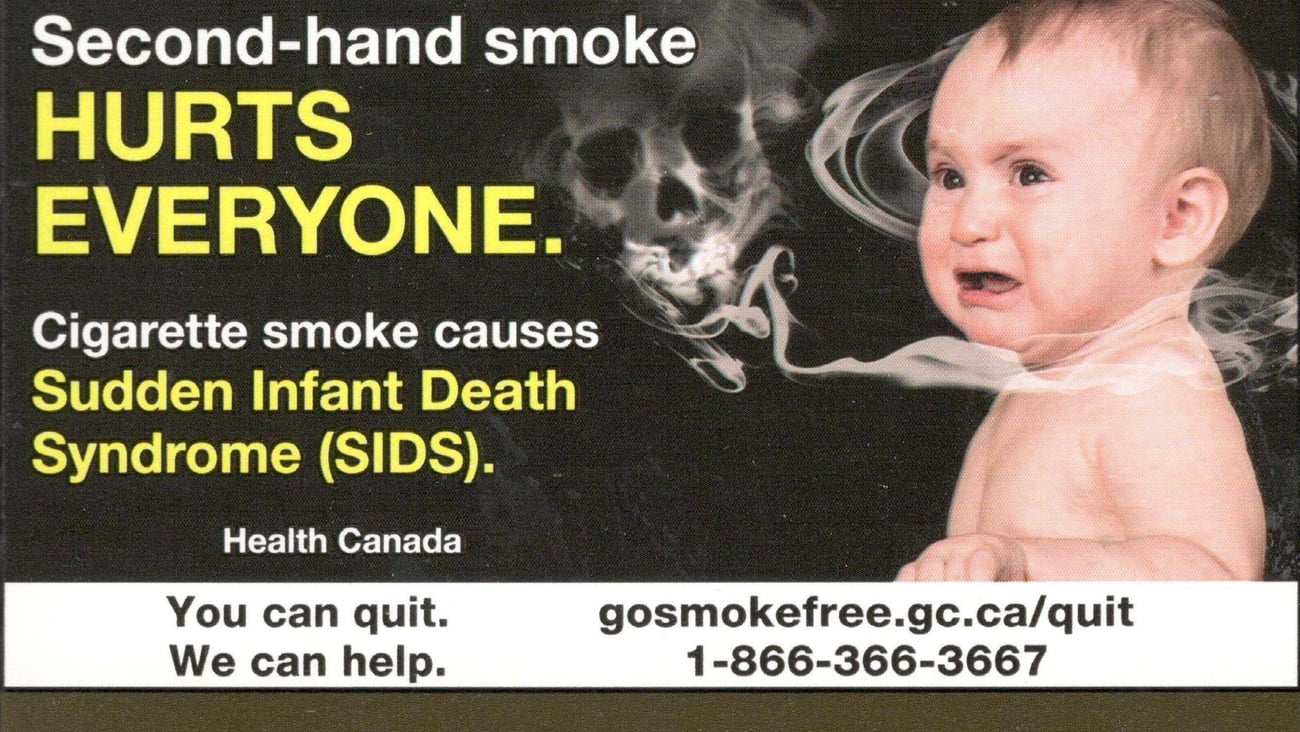 A baby surrounded by smoke on a Health Canada cigarette pack warning label. (Canadian Cancer Society)