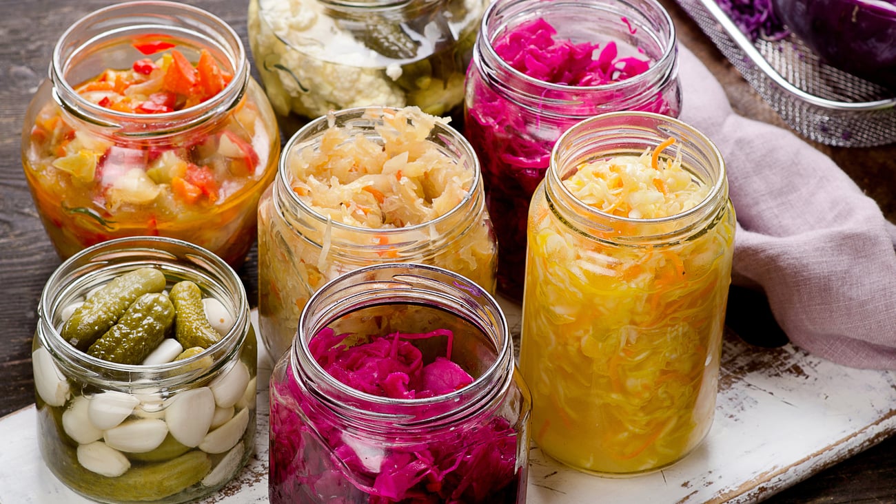 Several jars of colourful fermented foods