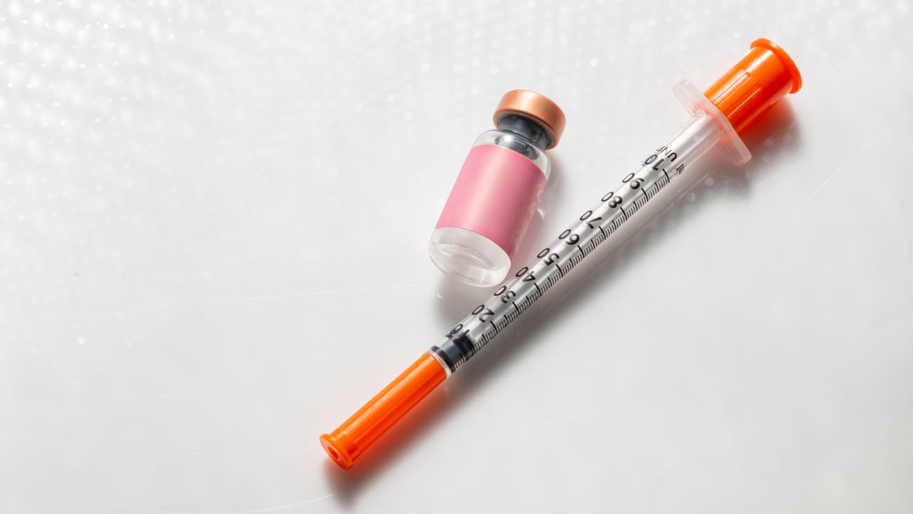 A vial and a syringe for injection.