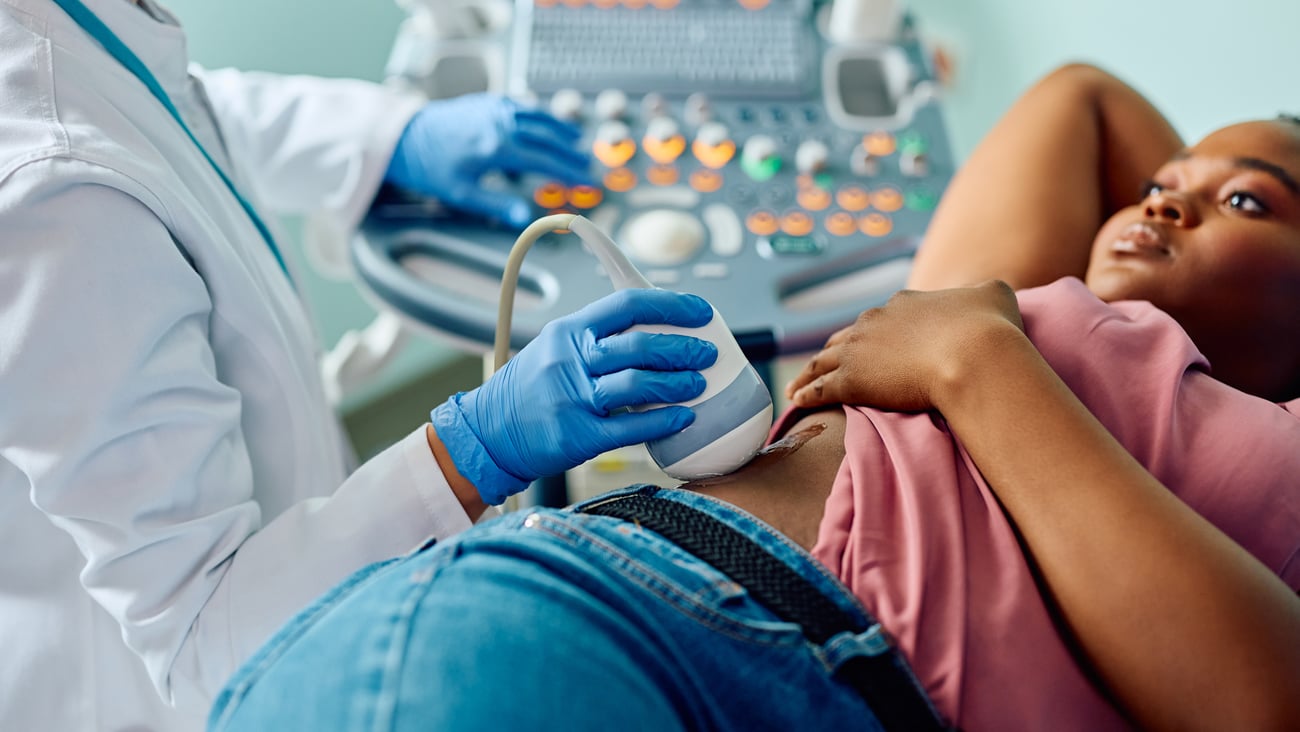 Young Black woman getting an ultrasound on her side