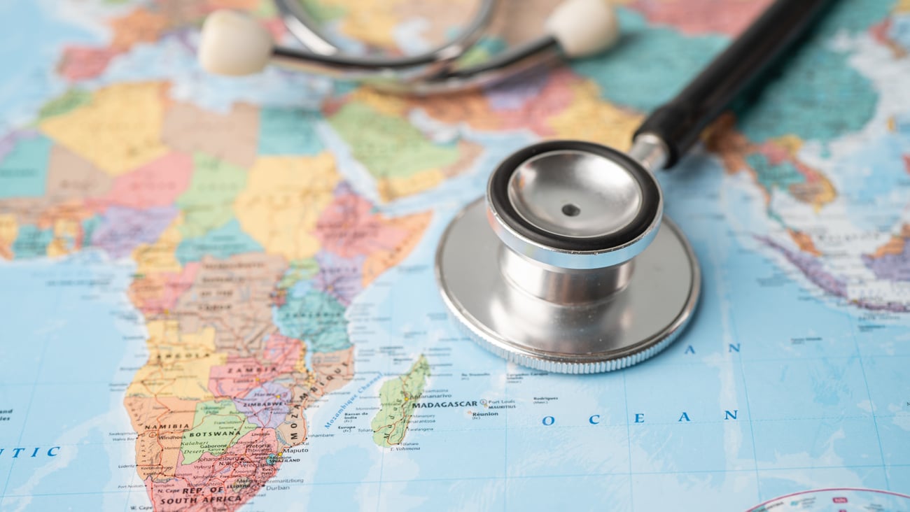 A stethoscope on a world map.